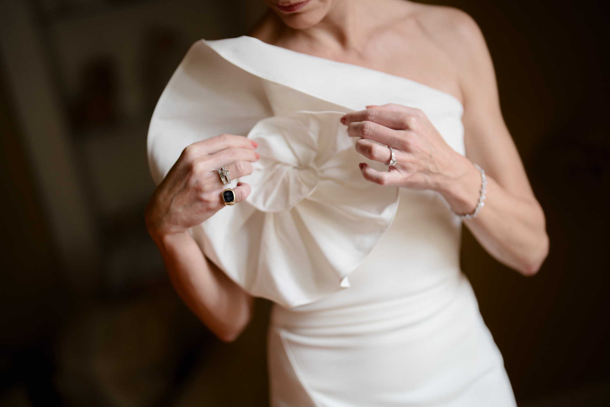 Bride adjusting getting ready at Inverlochy Castle