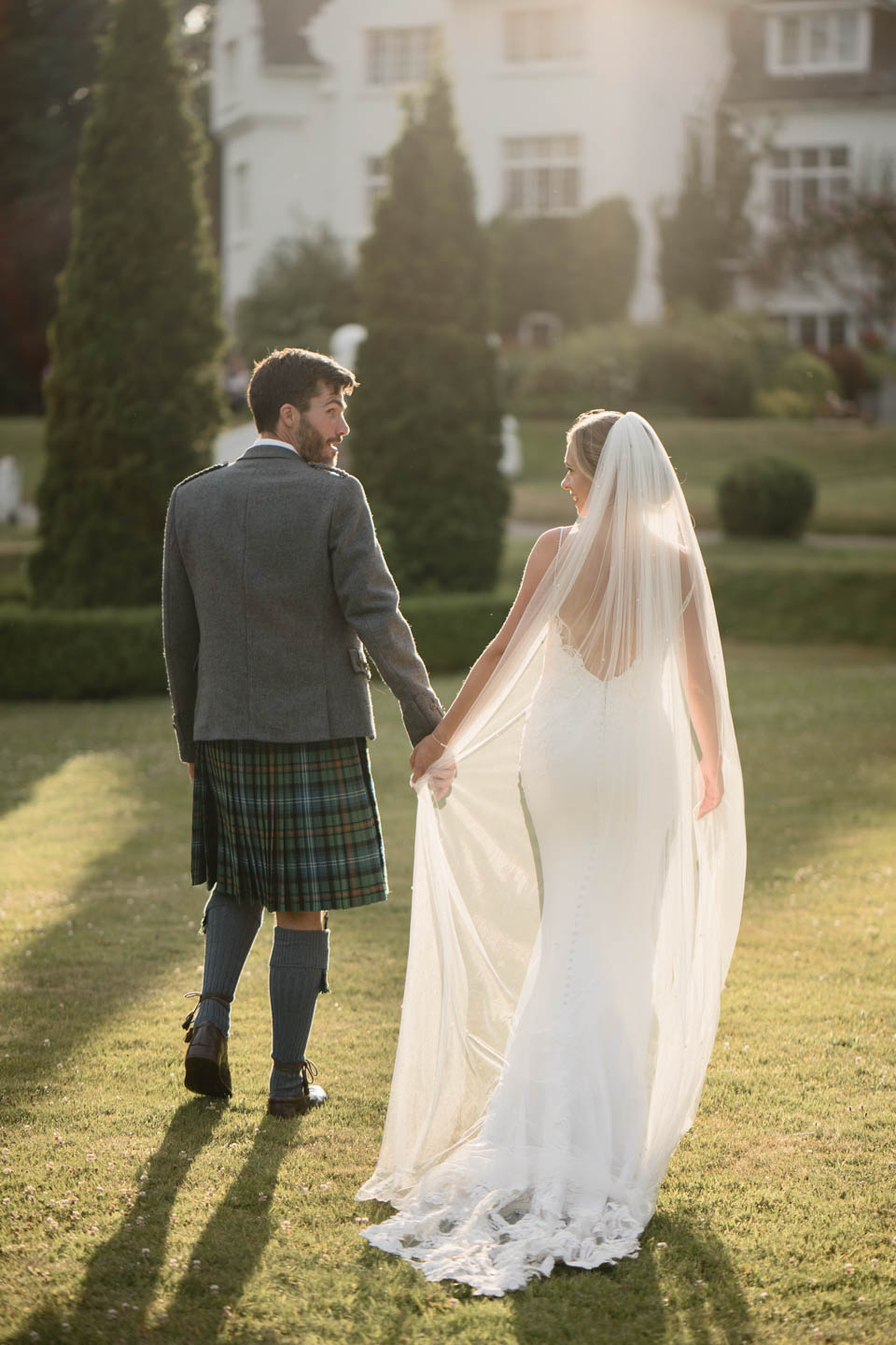 couple walking away bathed in sunlight